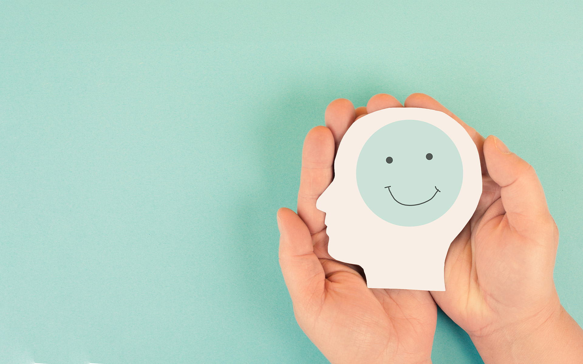 A modern dental practice with a blue and white chair, a dental treatment table, and medical equipment.